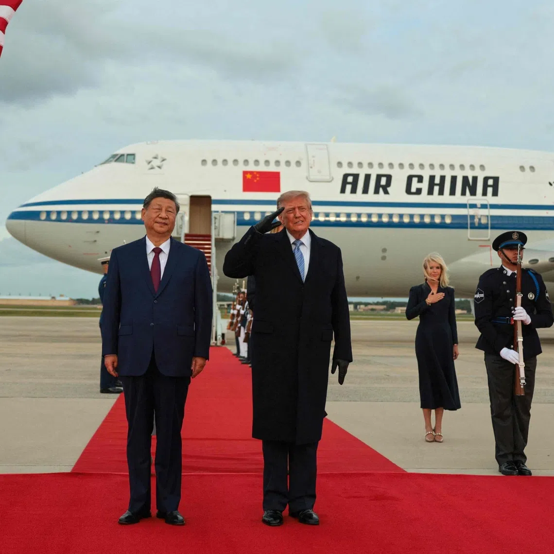 In a photo posted on social media, US President Donald Trump is not wearing a black glove that he is wearing in a press photo from Chinese President Xi Jinping’s arrival in the US on Sept 23. A number of other discrepancies were spotted.