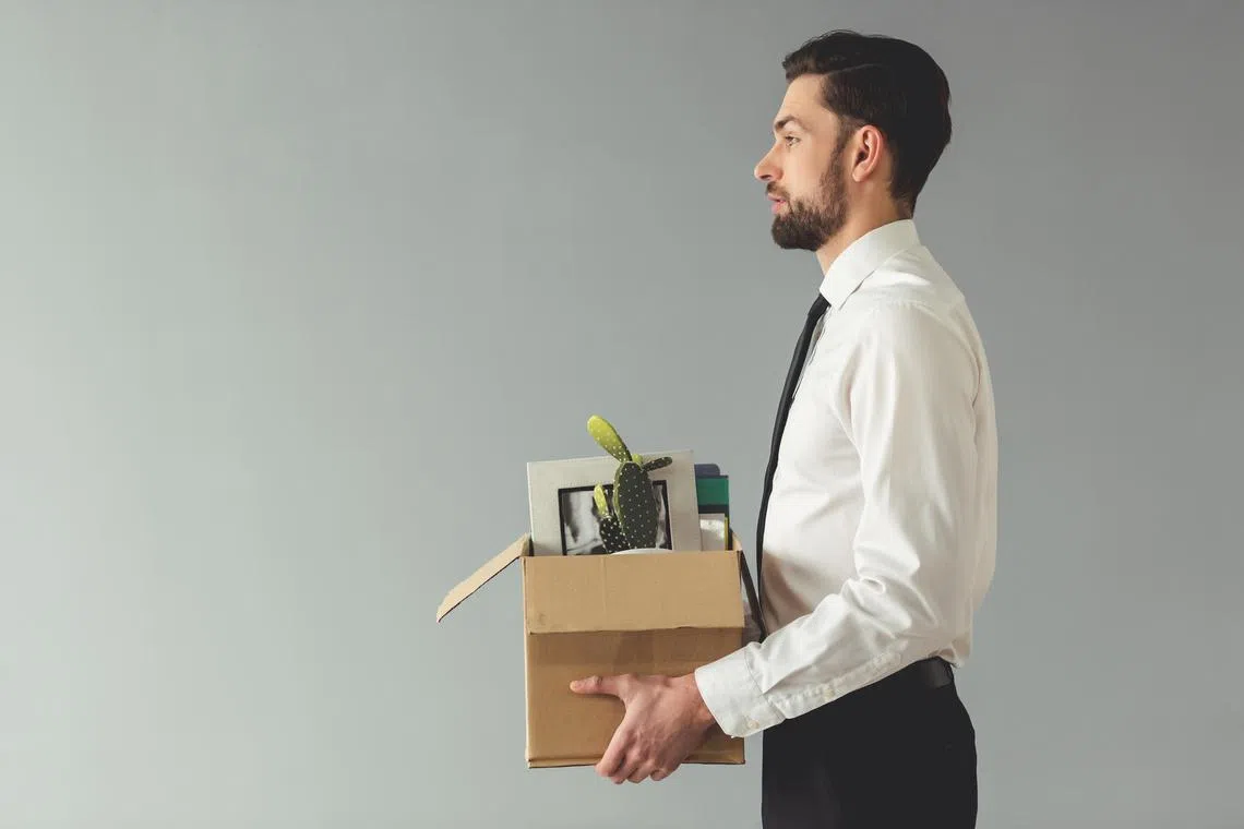 layoff11 - Getting fired. Side view of handsome businessman in formal wear holding a box with his stuff, on gray background


Credit: ISTOCKPHOTO