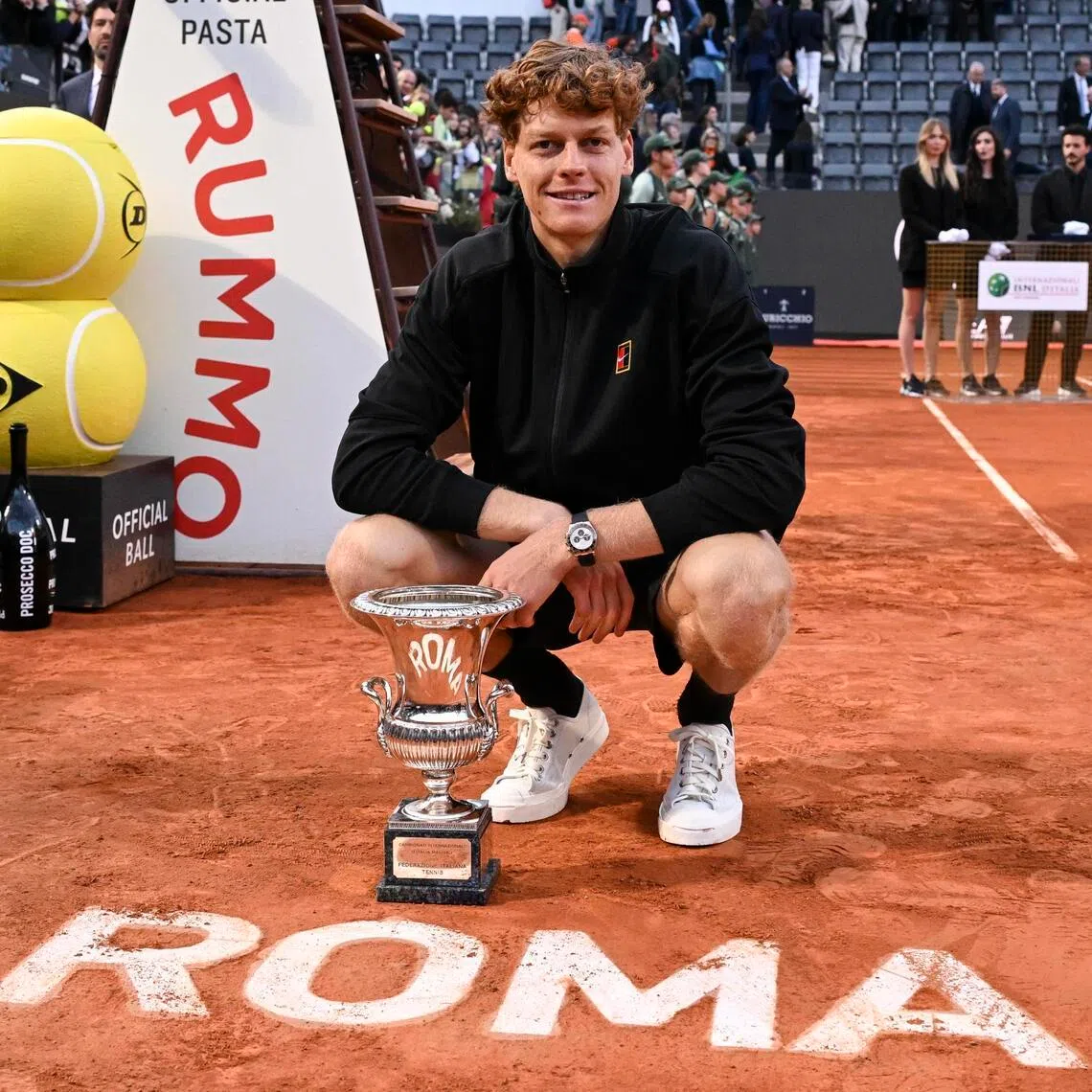 Jannik Sinner poses with the trophy after winning the Italian Open.