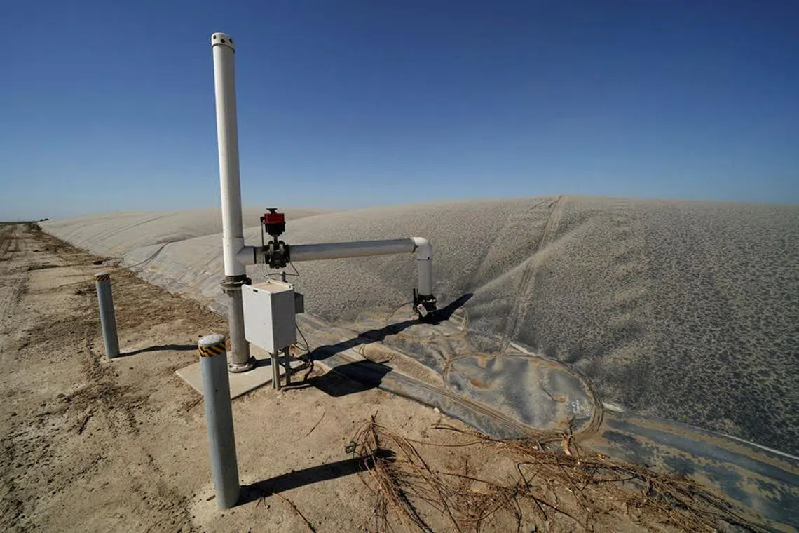 FILE PHOTO: A methane collecting dome that covers one of Airoso Circle A Dairy's waste collecting ponds is shown in Pixley, California, U.S., October 2, 2019. Picture taken October 2, 2019.       REUTERS/Mike Blake//File Photo