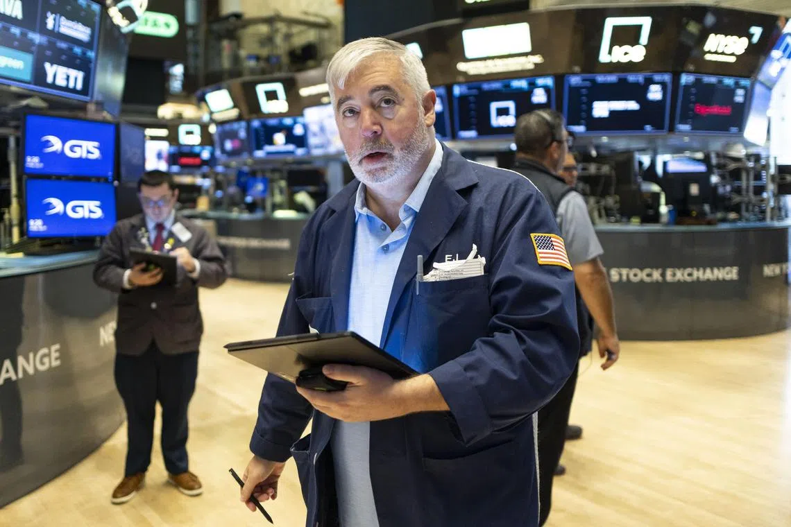 Traders working at the opening bell on the floor of the New York Stock Exchange, in New York City, on July 11.
