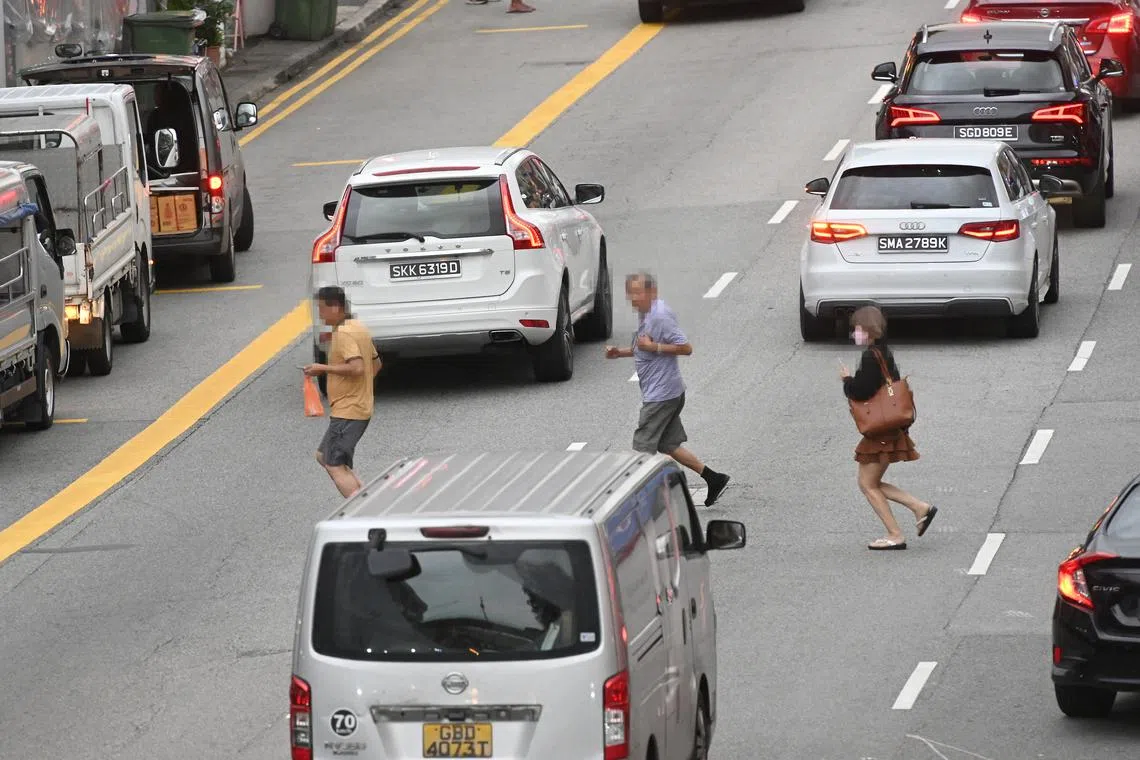 Jaywalkers along Geylang Road on Feb 13, 2023. Seniors jaywalking accounted for 73.9 per cent of fatal accidents.