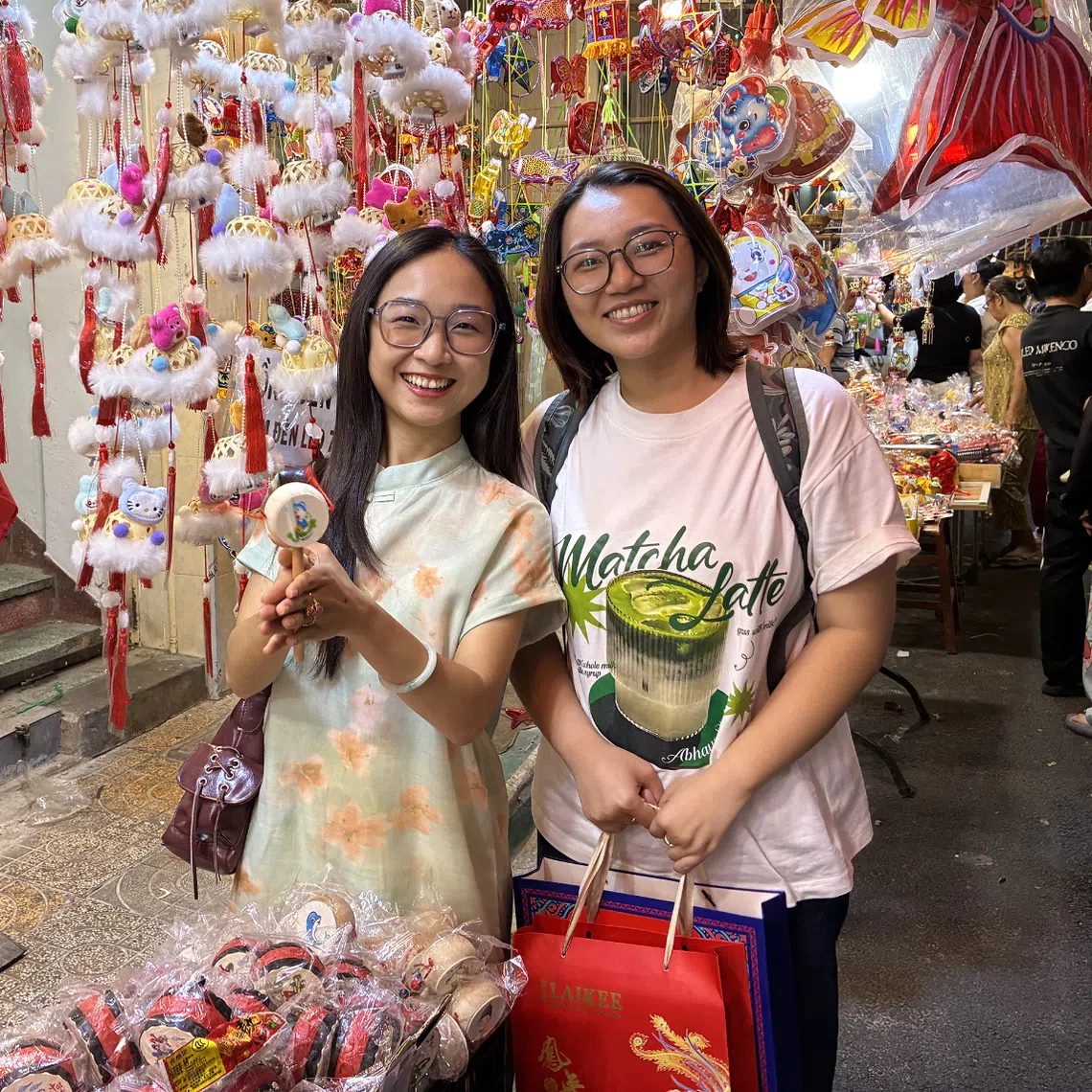 Ms Tran Ai Nhi (left) and Ms Tieu Nhou are part of a small group of young digital content creators on a mission to preserve their ancestral heritage, with help from social media.