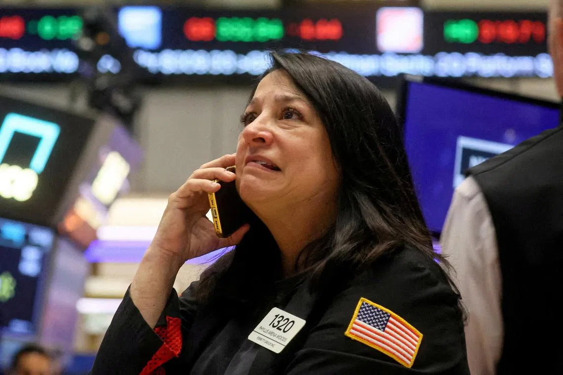 A trader works on the floor of the New York Stock Exchange, in New York City.