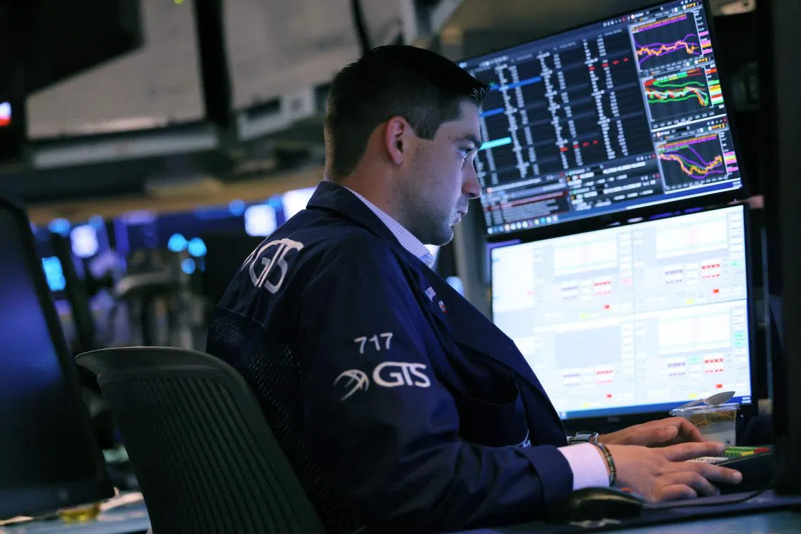 Traders work on the floor of the New York Stock Exchange, in New York City. 