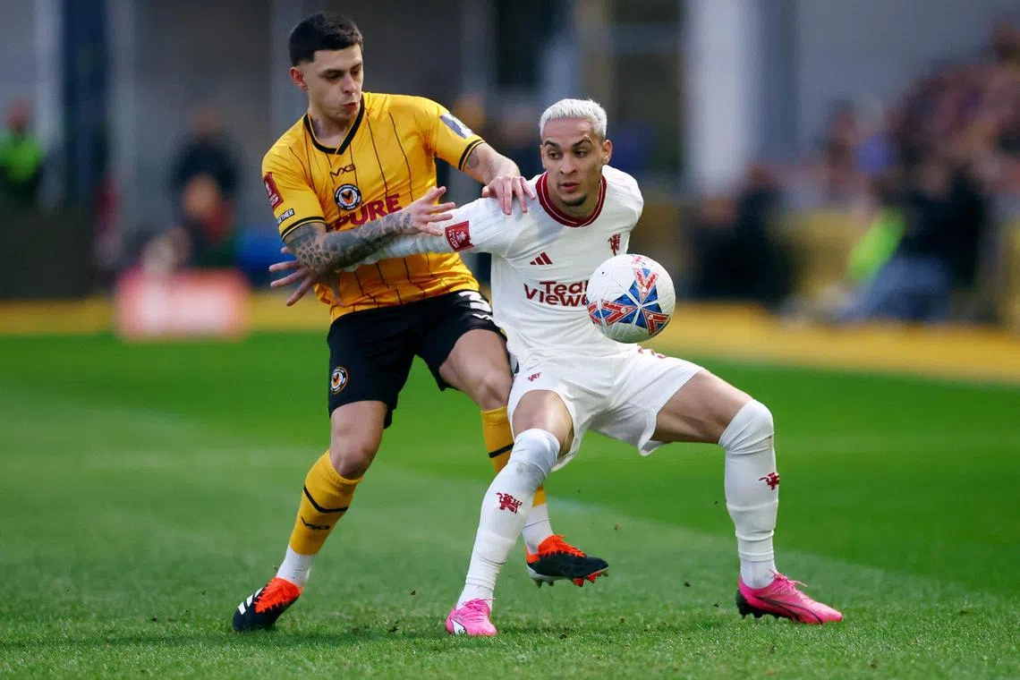 Newport County AFC's Adam Lewis in action with Manchester United's Antony during the FA Cup.