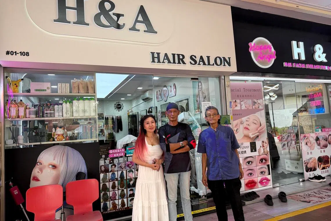 (From left) Hair salon owner Angel Song welcoming barbers Yuzzrie Adahar and Maksum Hashim after the barber shop they were working for had to downsize due to rent hikes.
