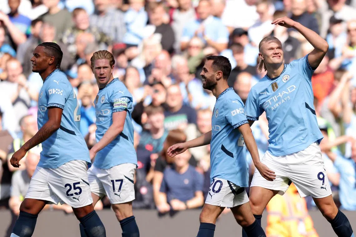Erling Haaland celebrates scoring City's third goal, one of three goals scored in less than four minutes.