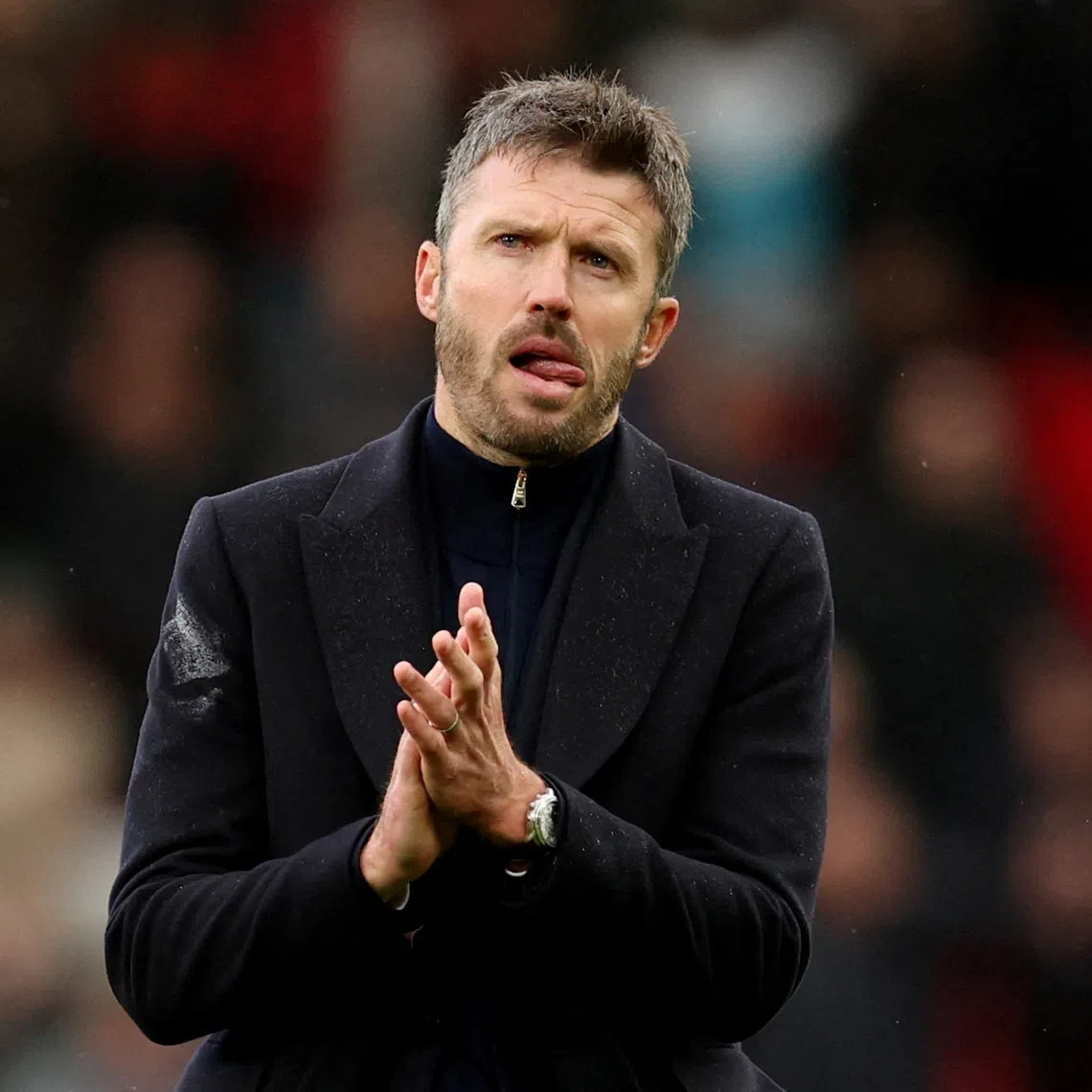 Manchester United manager Michael Carrick looks dejected as he applauds fans after his side’s 3-0 home defeat to Bournemouth on Oct 25.