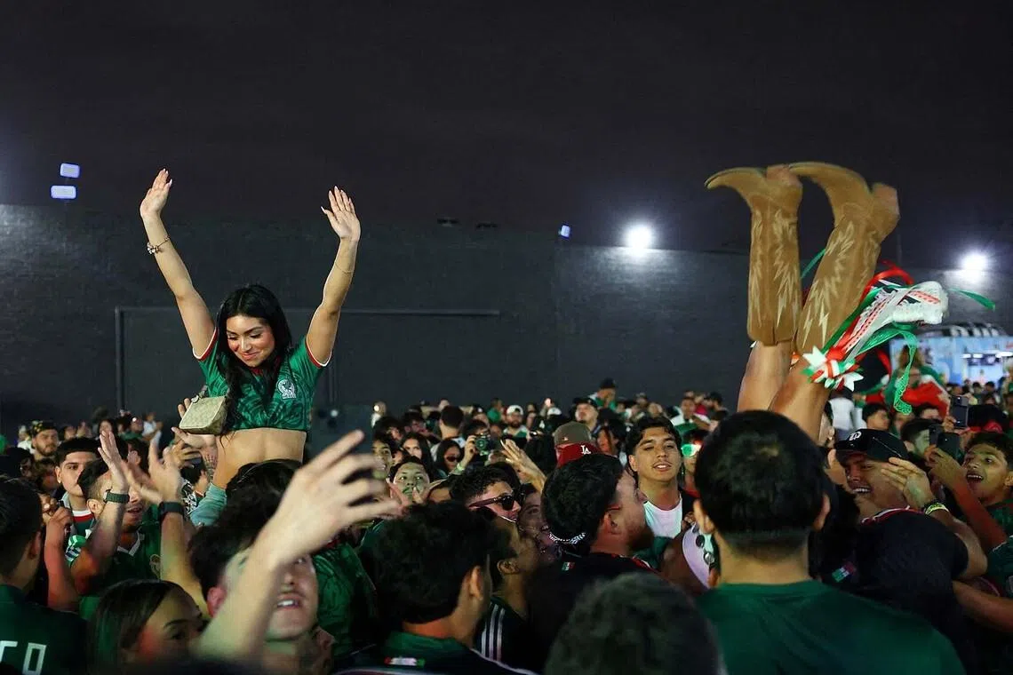Soccer Football - FIFA World Cup 2026 - Round of 32 - Mexico v Ecuador - Fans gather in Los Angeles - Los Angeles, California, U.S. - June 30, 2026 Mexico fans celebrate at a watch party in Boyle Heights, Los Angeles during the match REUTERS/Lisi Niesner TPX IMAGES OF THE DAY