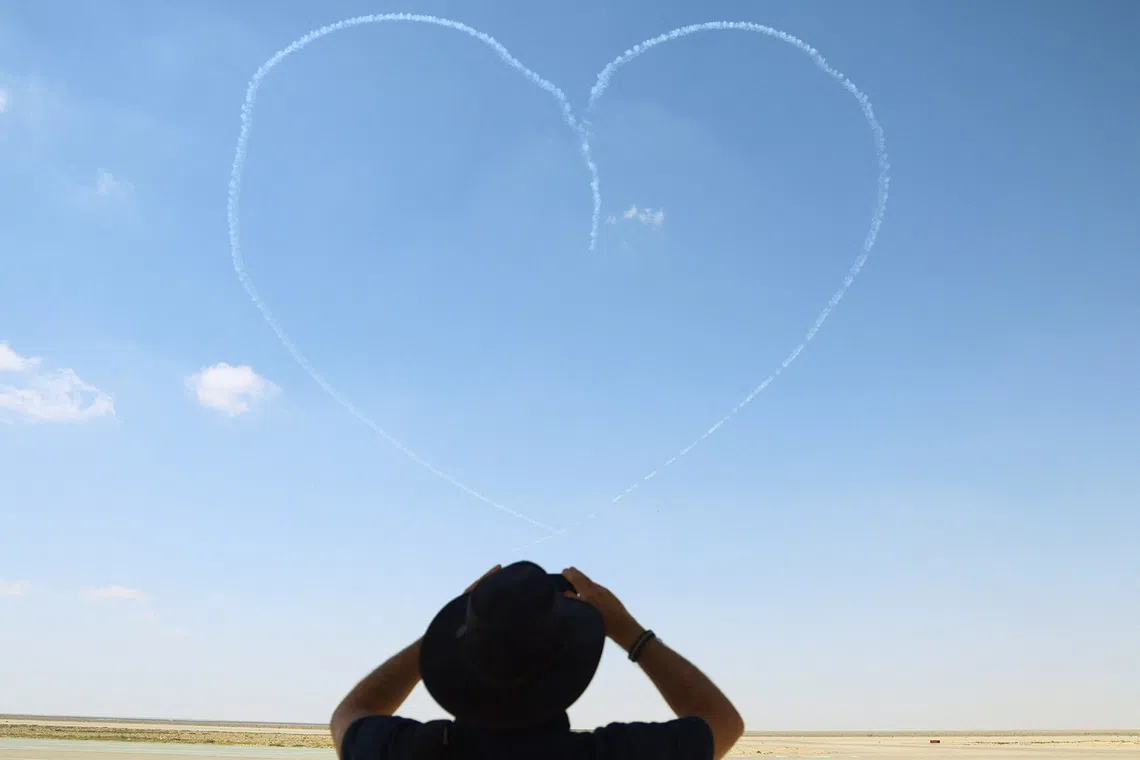 UAE aerobatic team "Fursan Al Emarat" creates the shape of a heart during their display performance at the second international air show and aerospace expo at El Alamein International Airport in El Alamein, Egypt, September 9, 2026. Egypt is hosting the event from September 8 to 10, 2026, with more than 100 aircraft participating in flying and static displays. REUTERS/Amr Abdallah Dalsh