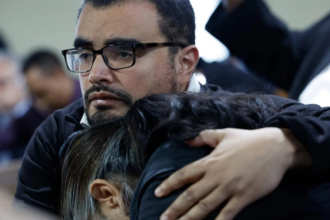 People embracing during a vigil for victims of the Francis Scott Key Bridge collapse at the Mount Olive Baptist Church in Baltimore, Maryland, on March 26, 2024.