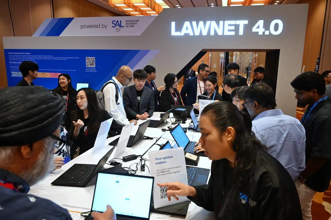 Participants visiting the exhibition booths on the second day of the TechLaw.Fest at the Sands Expo and Convention Centre on Sept 11 .