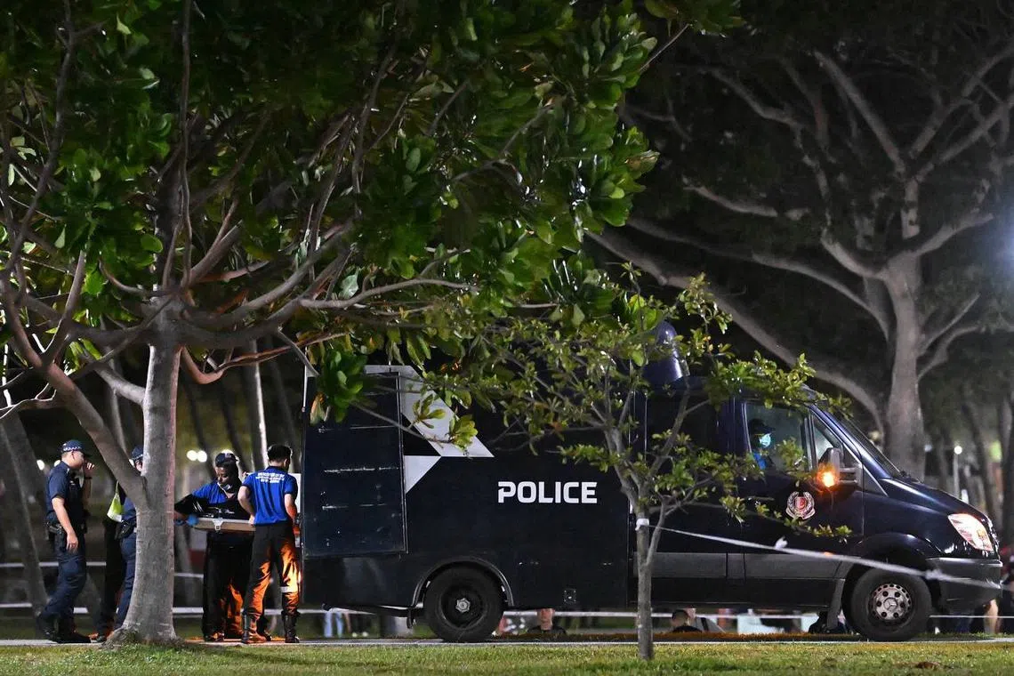 The boy's body being loaded into a police van at 12.42am on Aug 31.