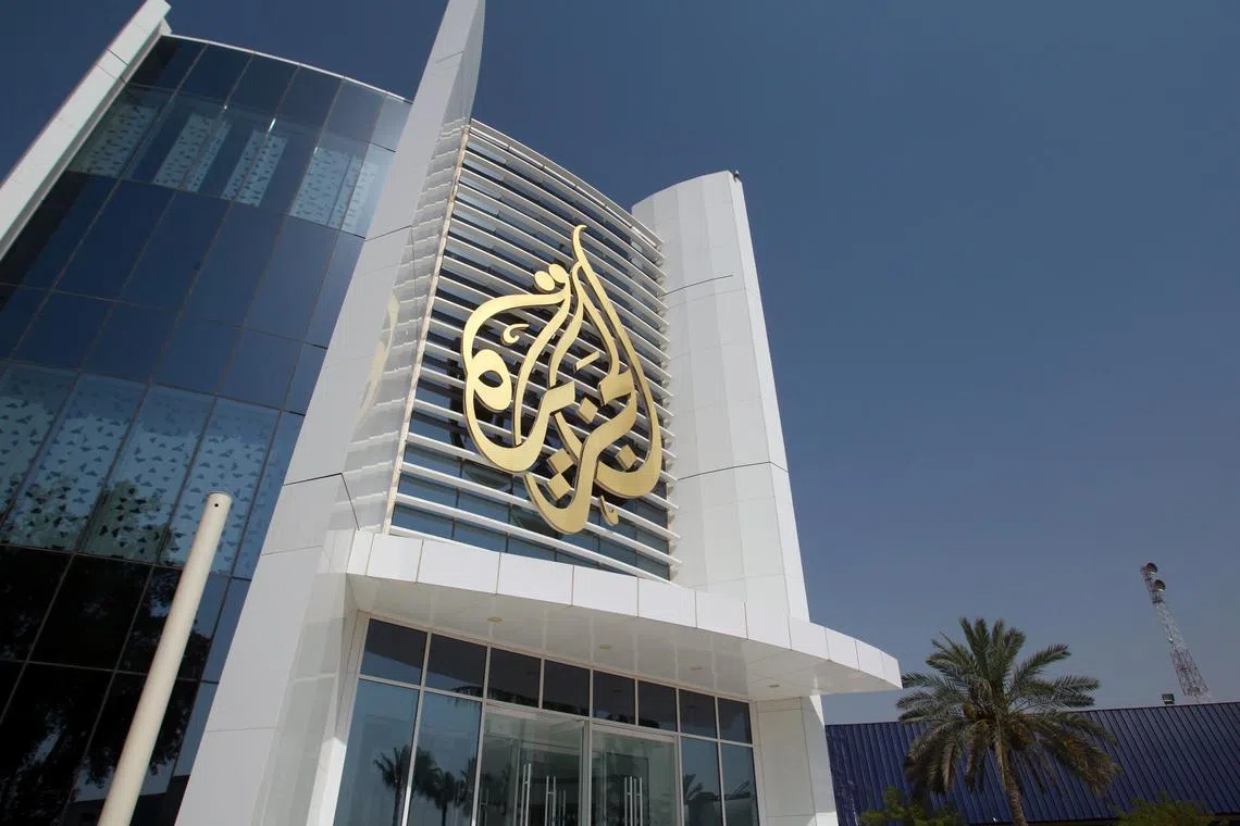 FILE PHOTO: The Al Jazeera Media Network logo is seen on its headquarters building in Doha, Qatar June 8, 2017. REUTERS/Naseem Zeitoon/File Photo