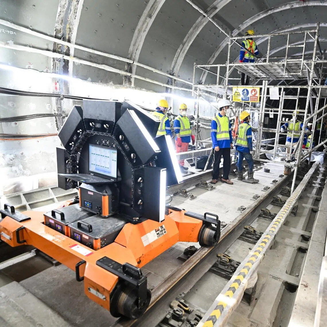 Workers doing finishing works using epoxy and grouting to seal up any gaps inside the tunnel near Dakota MRT station during an update on progress of Circle Line tunnel strengthening works on March 26, 2026.