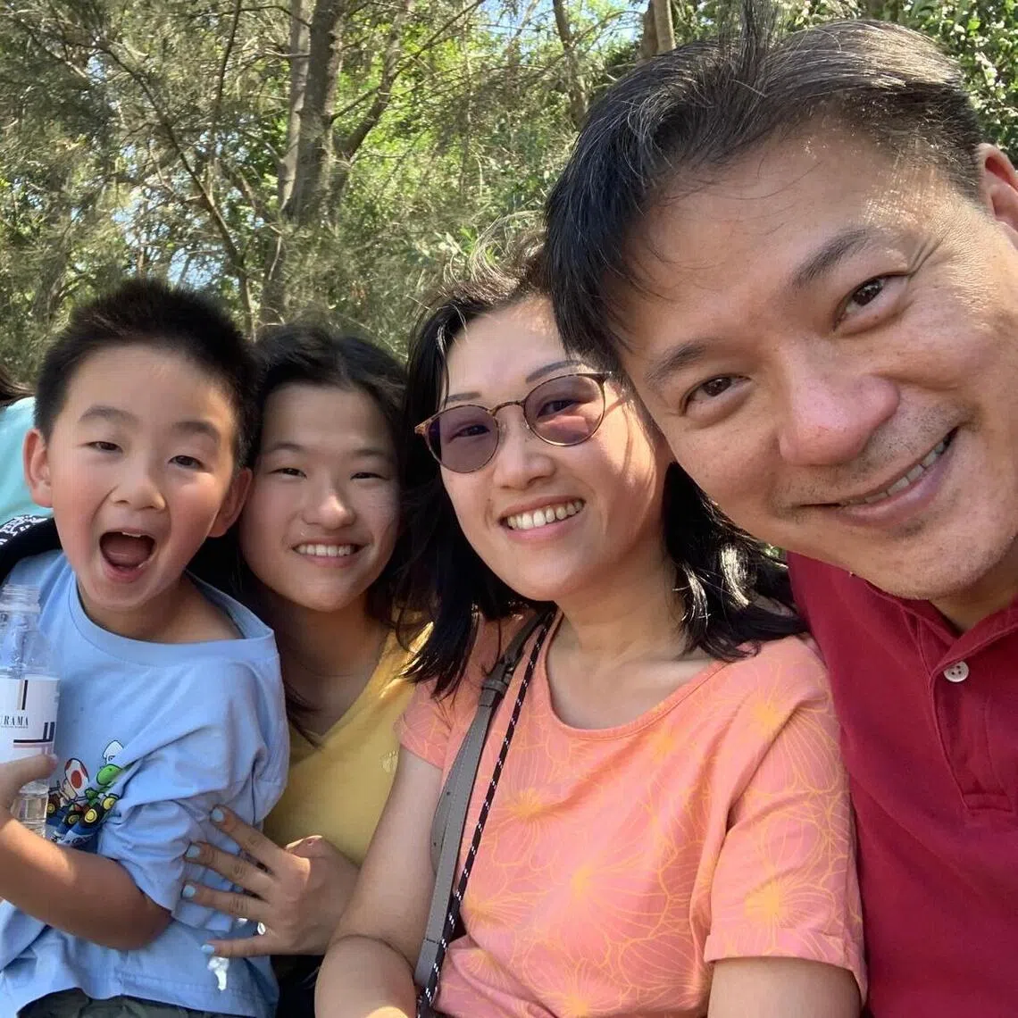 Madam Karin Lee and her husband, Mr Edward Wong, with their three daughters and son.
