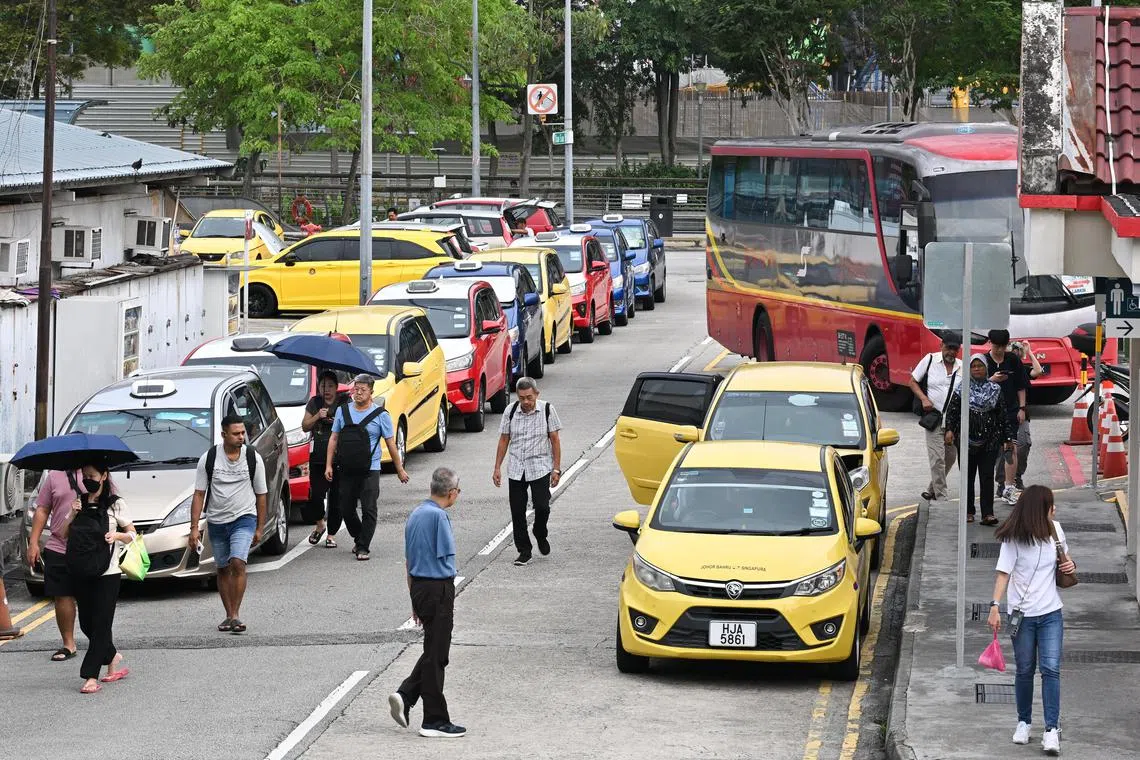 ST20240825-202447600877-Lim Yaohui-Elaine Lee-elridesxx/
Taxis parked next to the Ban San Street terminal on Aug 25, 2024.
Story is about illegal cross-border rides and the different stakeholders involved in this issue. Will be speaking with the licensed cross-border taxi drivers situated at Ban San Street Terminal about their competition with illegal cross-border drivers as well as users' motivation for using the services of these licensed cross-border drivers.
(ST PHOTO: LIM YAOHUI)