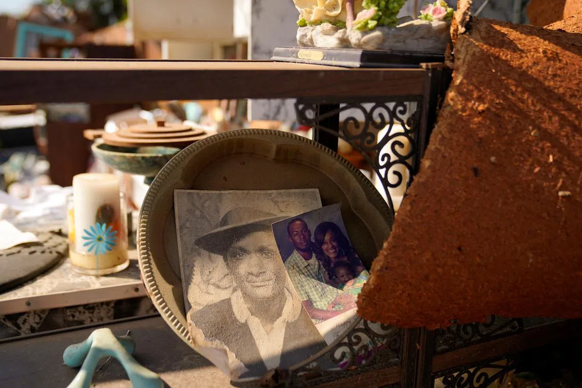 Family photos are seen inside a home that no longer has a roof, after thunderstorms spawning high straight-line winds and tornadoes ripped across the state, in Rolling Fork, Mississippi, U.S. March 26.