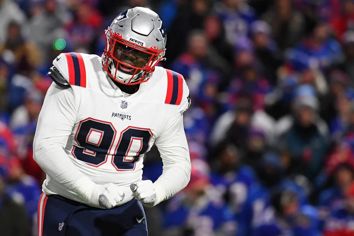 FILE PHOTO: Dec 6, 2021; Orchard Park, New York, USA; New England Patriots defensive end Christian Barmore (90) reacts to a defensive play against the Buffalo Bills during the first half at Highmark Stadium. Rich Barnes-USA TODAY Sports/File Photo