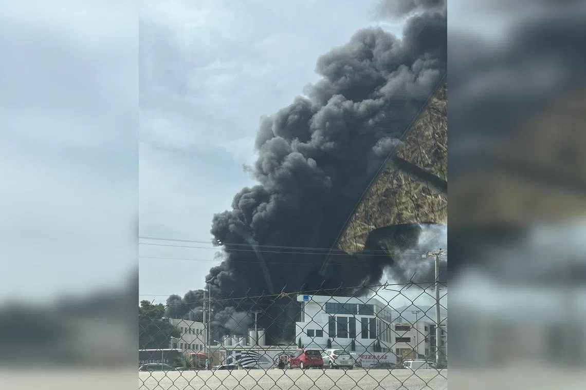 Fourteen fire trucks were sent to the scene, after a fire broke out at an Athens cookware factory.