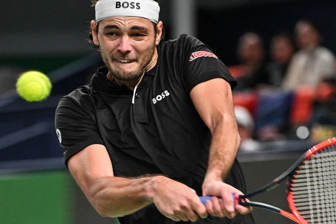 Taylor Fritz of the US hits a return to France's Terence Atmane during their match at the Shanghai Masters.
