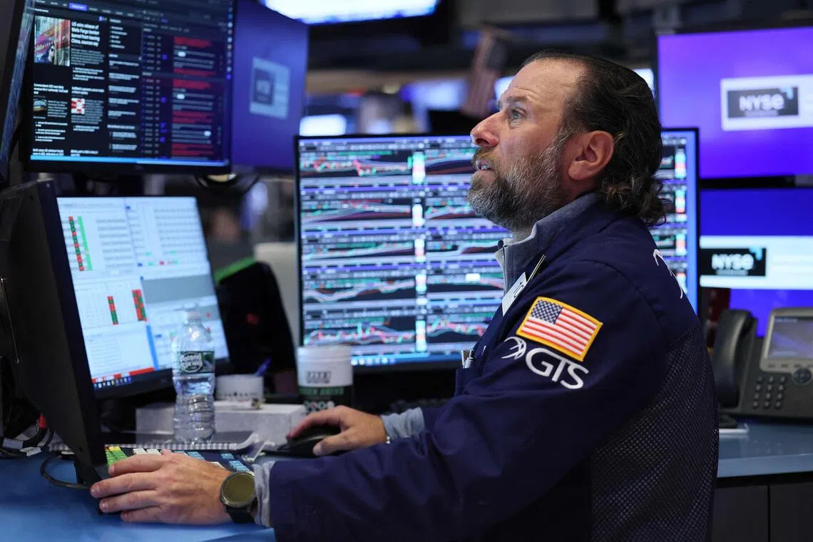Traders working on the floor of the New York Stock Exchange, during morning trading, on Sept 17.