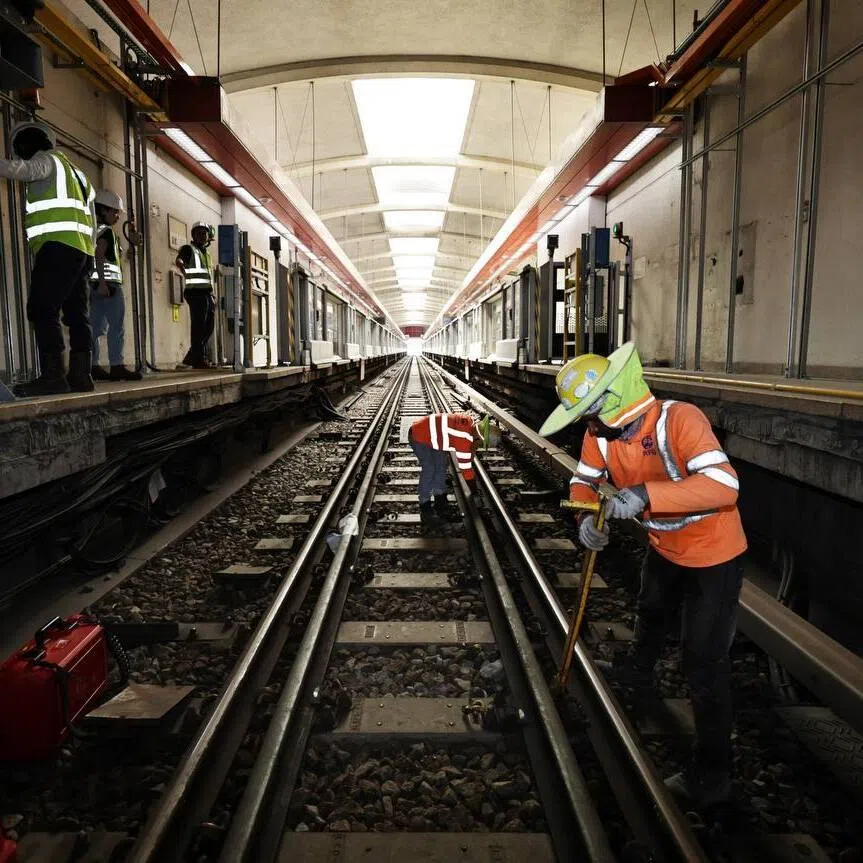 Workers carrying out works on the track at Tanah Merah MRT station on Nov 30.