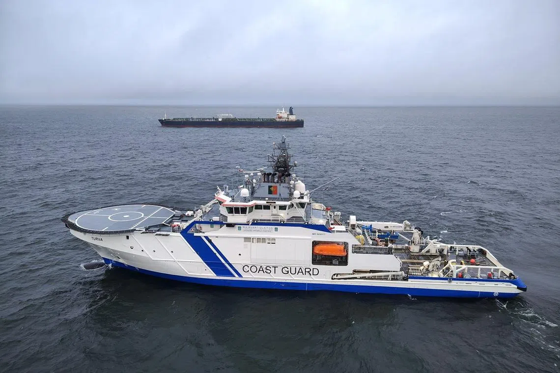 Finnish Border Guard's ship Turva and oil tanker Eagle S sail on the sea outside the Porkkalanniemi, Finland on December 26, 2024. RAJAVARTIOSTO-Finnish Border Guard/LEHTIKUVA/HANDOUT via REUTERS