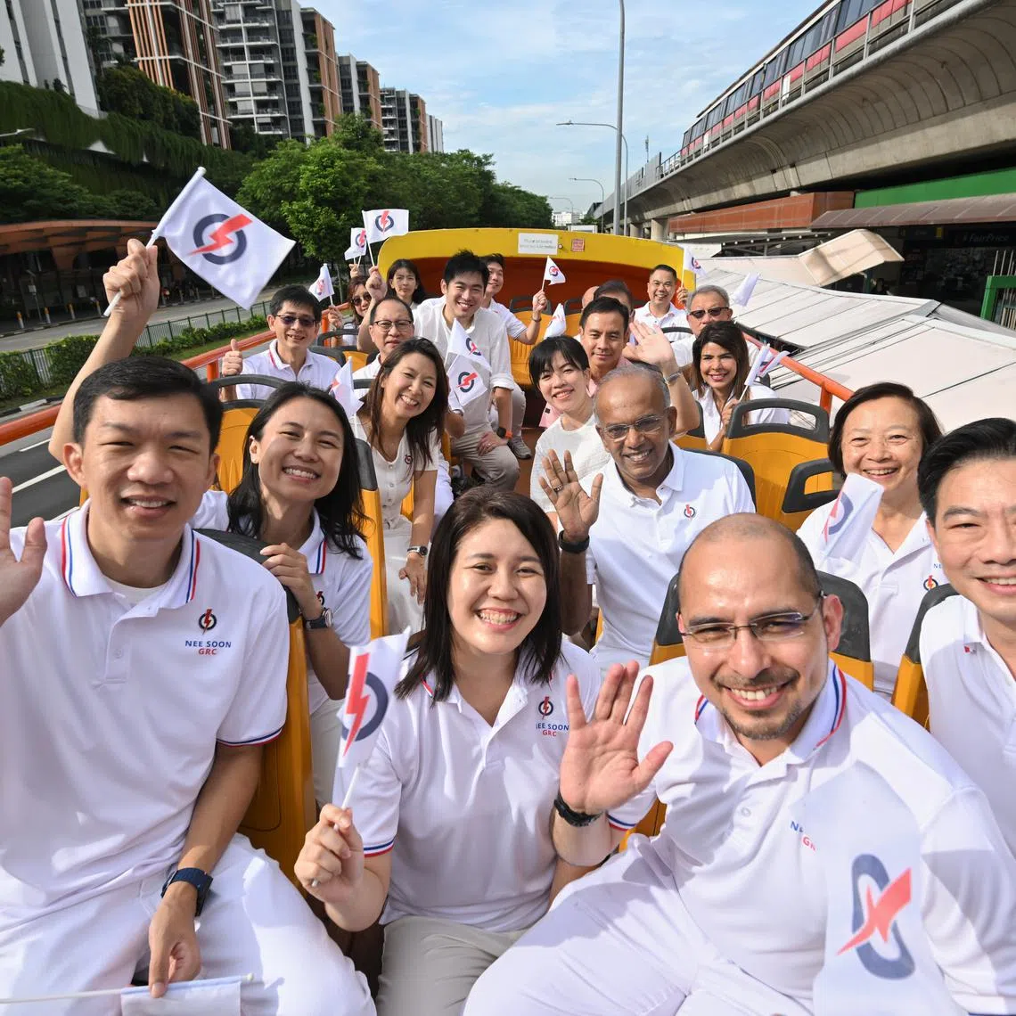 Law and Home Affairs Minister K. Shanmugam (centre right) with his team on the PAP Nee Soon GRC Victory Parade on May 4.