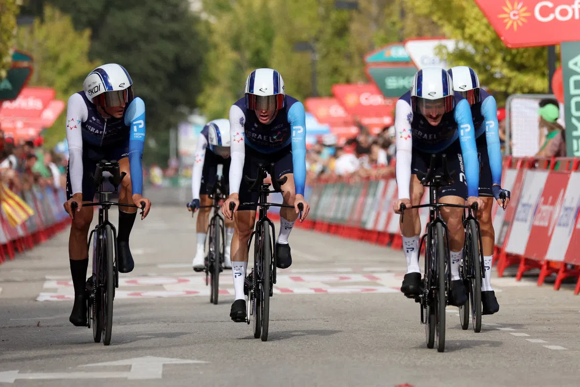FILE PHOTO: Cycling - Vuelta a Espana - Stage 5 - Figueres to Figueres - Figueres, Spain - August 27, 2025 Team Israel - Premier Tech cross the finish line after stage 5 REUTERS/Bruna Casas/File Photo
