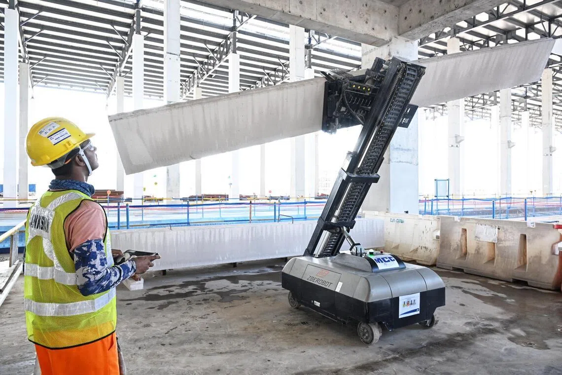 Demonstration of a Autoclaved Lightweight Concrete (ALC) wall panel installation robot seen at the Changi East Depot construction site on May 20.