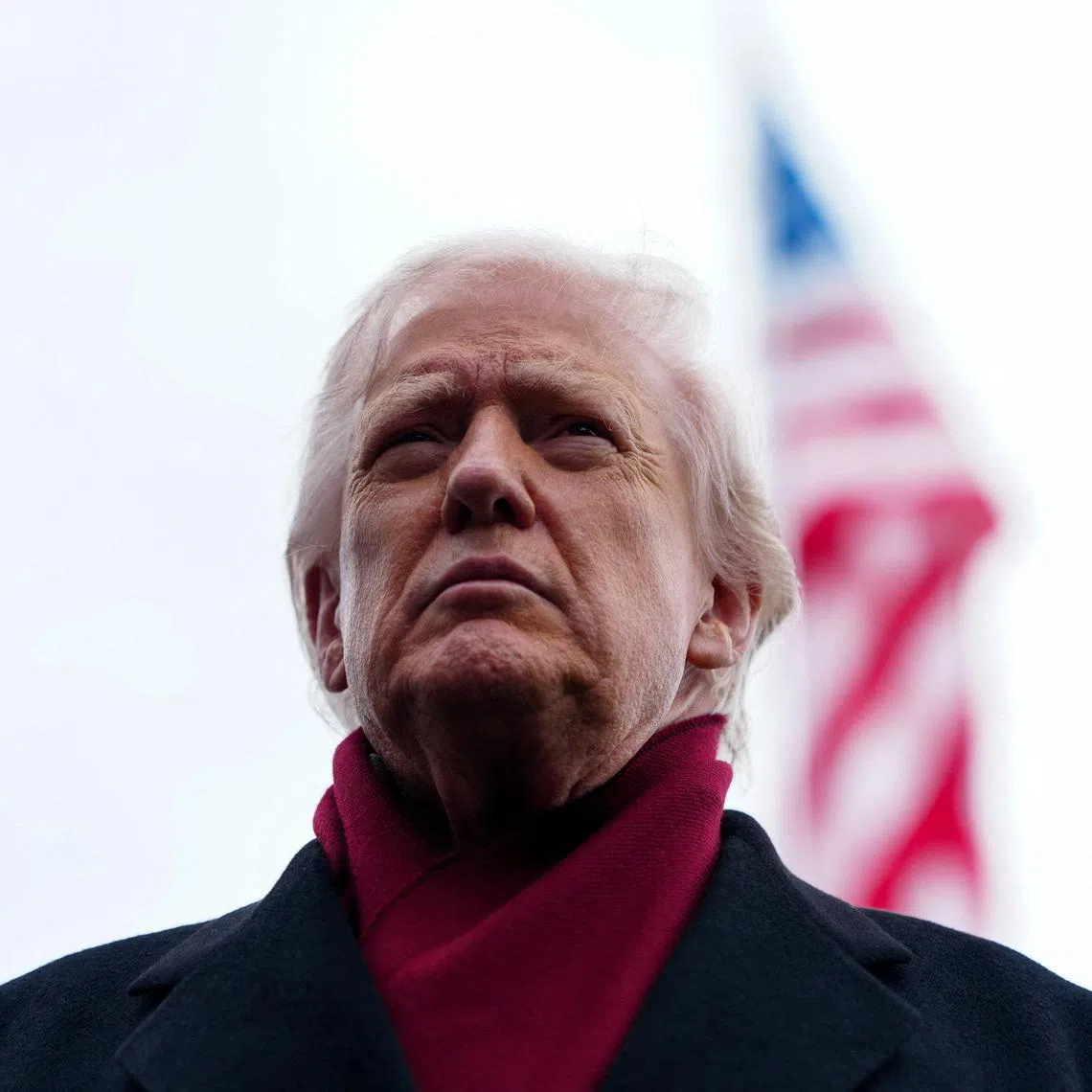 U.S. President Donald Trump looks on as he walks to board Marine One to depart for Joint Base Andrews, from the South Lawn at the White House in Washington, D.C., U.S., November 22, 2025. REUTERS/Aaron Schwartz