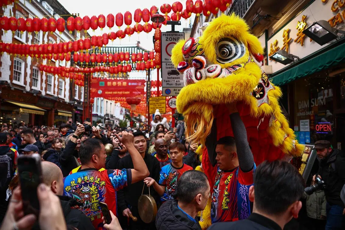 A Chinese Lion Dance team performing for spectators during celebrations for Chinese Lunar New Year of the Dragon in central London on Feb 10, 2024. 