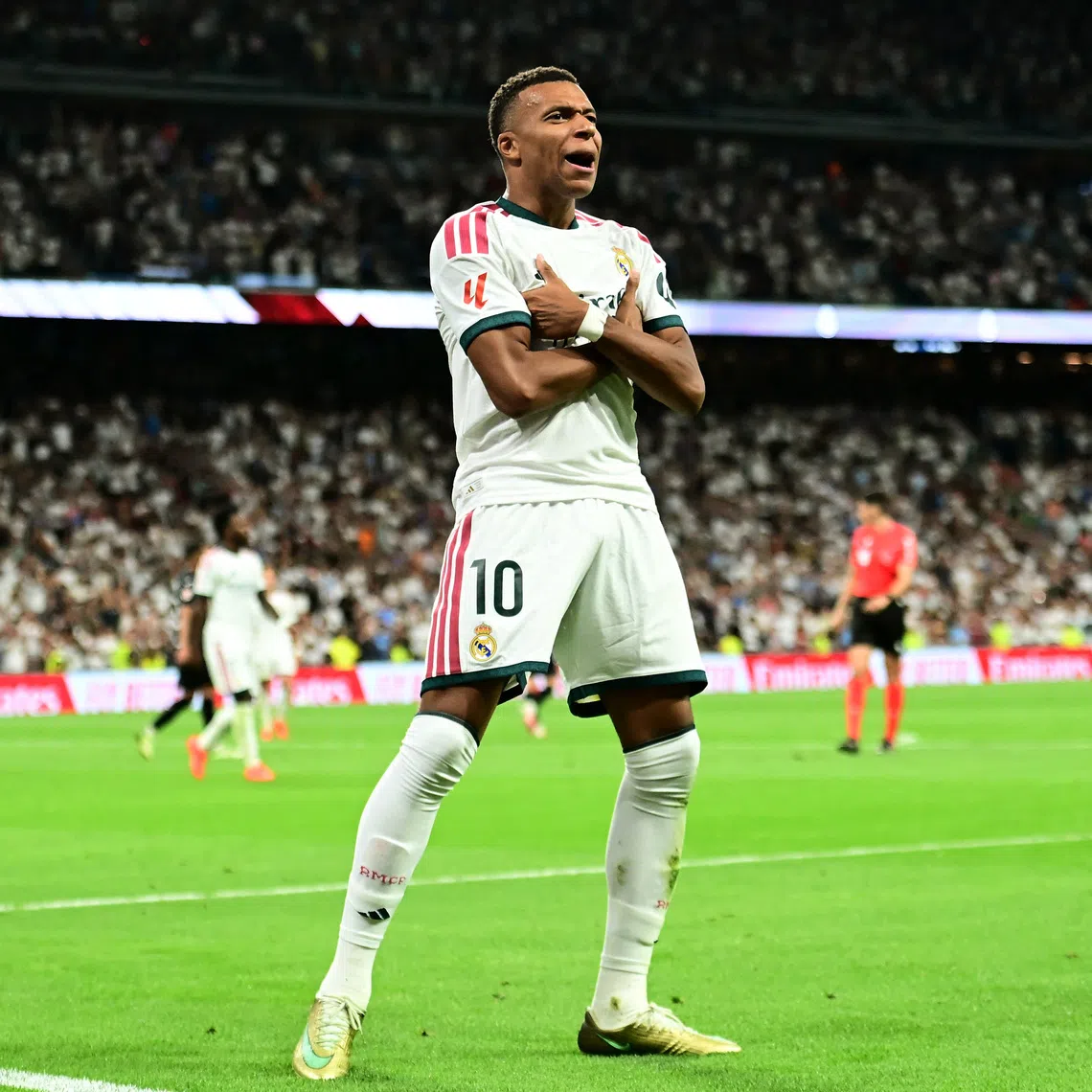 Real Madrid’s Kylian Mbappe celebrates scoring their second goal on Aug 26.