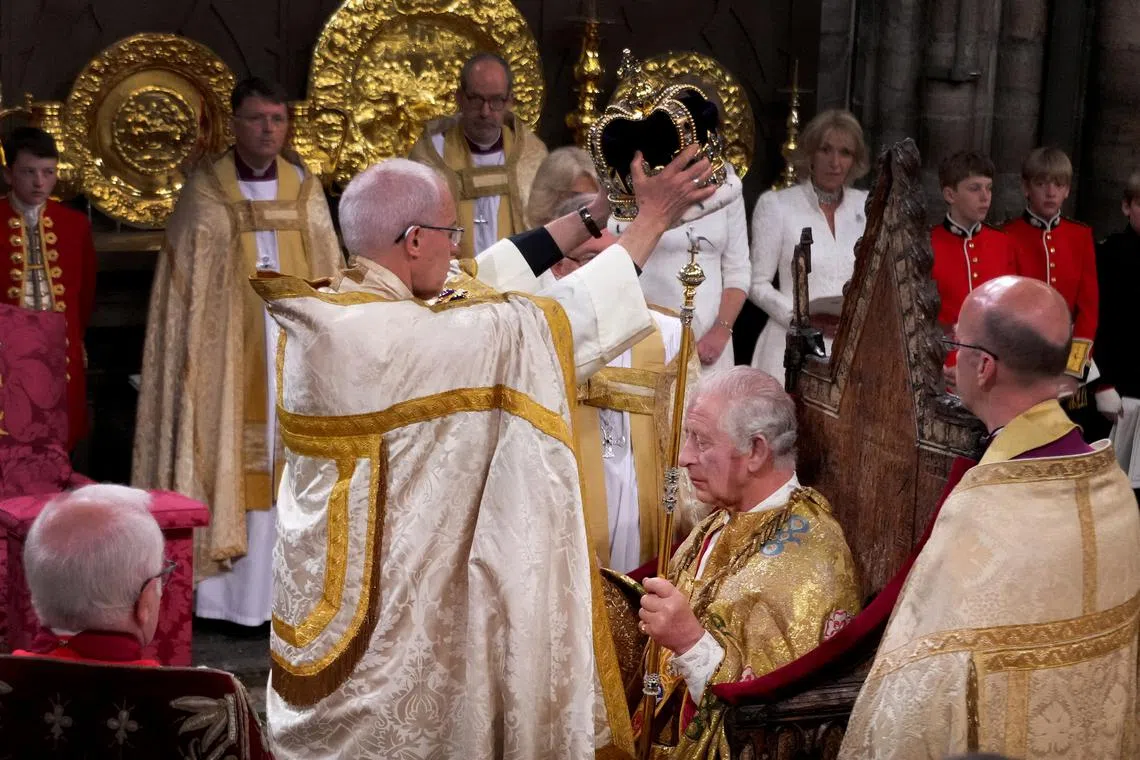 FILE PHOTO: King Charles III is crowned with St Edward's Crown by The Archbishop of Canterbury the Most Reverend Justin Welby during his coronation ceremony in Westminster Abbey, London. Picture date: Saturday May 6, 2023.   Victoria Jones/Pool via REUTERS/File Photo