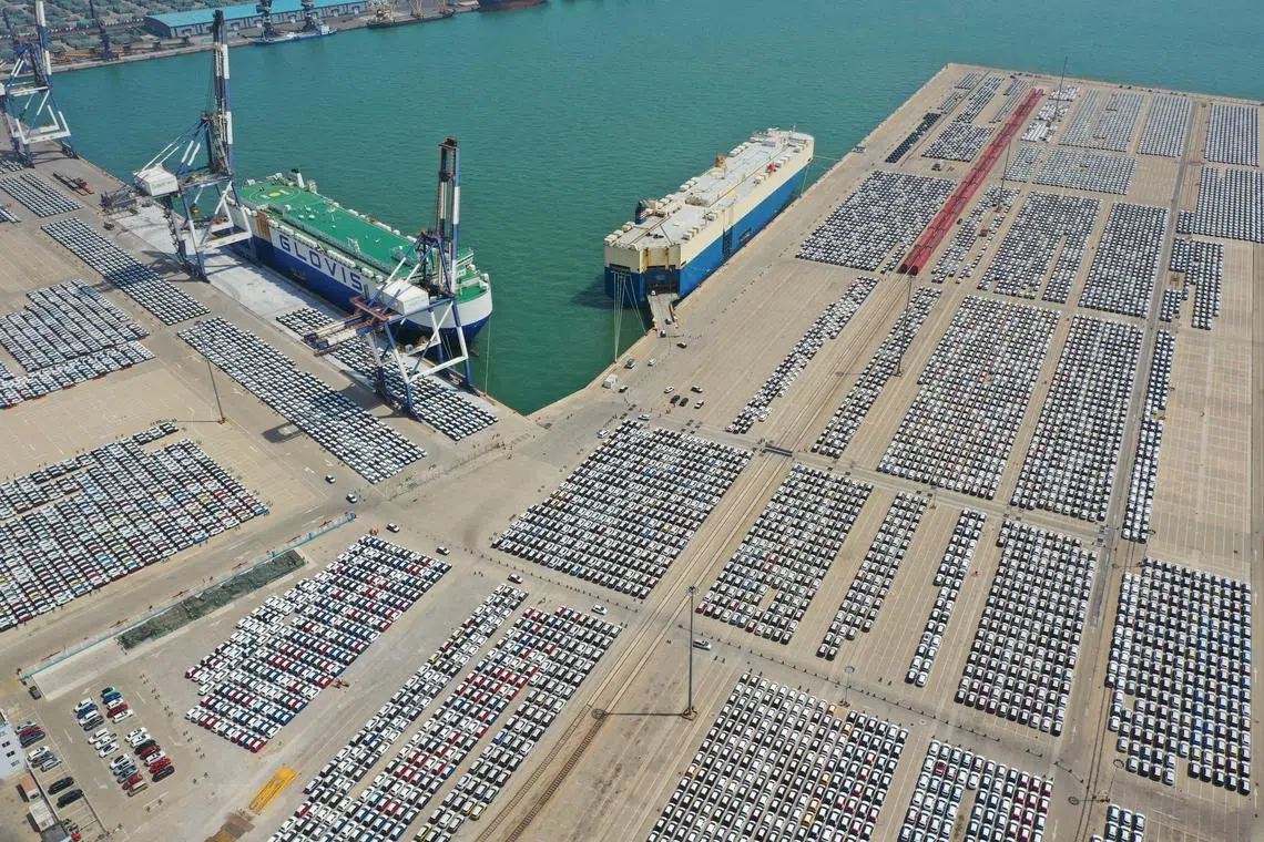An aerial view shows cars for export at a port in Yantai, Shandong province, China May 3, 2023. China Daily via REUTERS/File Photo