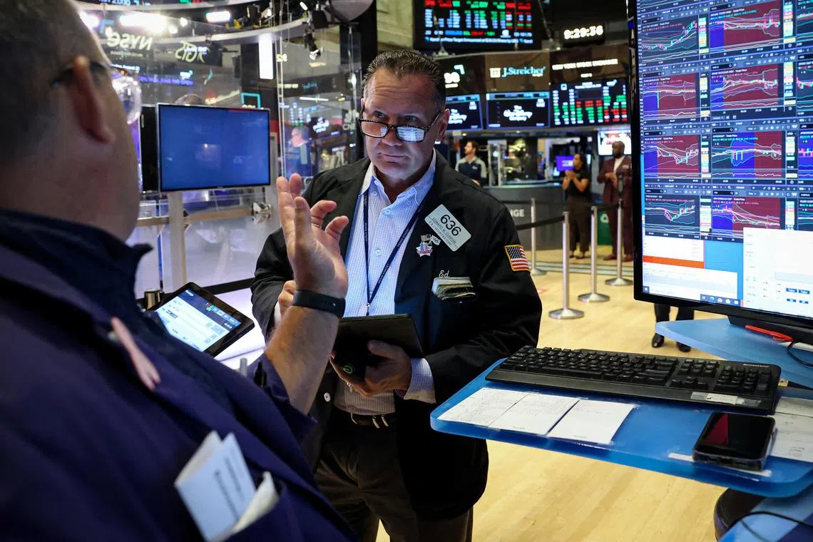 Traders working on the floor of the New York Stock Exchange, in New York City, on Aug 21.