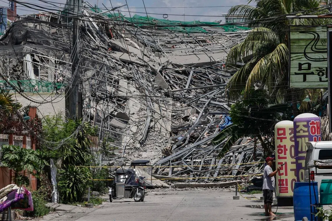 epa12989461 A view of a collapsed building in a residential district in Angeles City, Pampanga province, Philippines, 24 May 2026. The structure, which was under construction, collapsed early Sunday morning during a thunderstorm. Search and rescue operations are ongoing, with authorities working to locate an estimated 30 to 40 people believed to be trapped in the rubble.  EPA/ROLEX DELA PENA