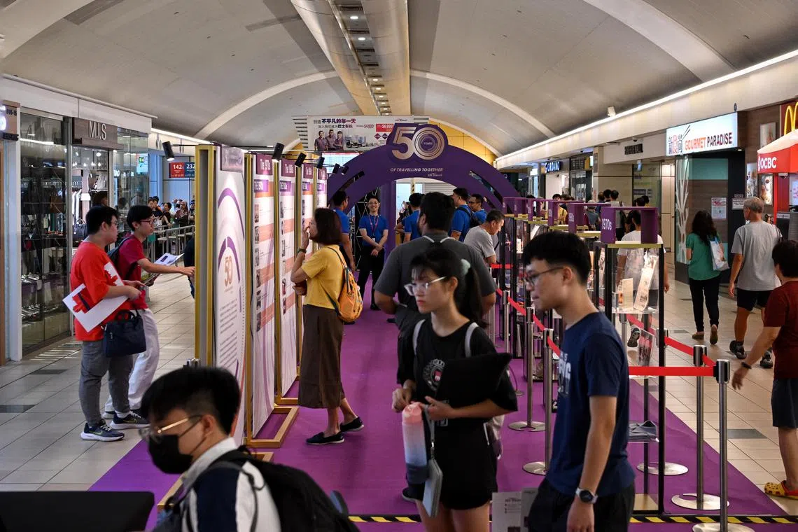 ST20231019_202397034796 Kua Chee Siong/ elsbs19/
Members of the public at the heritage exhibition themed "50 Years of Travelling Together" at Singapore’s very first air-conditioned bus interchange at Toa Payoh Interchange on Oct 19, 2023.
SBS Transit Celebrates 50 Years of Keeping Singapore on the Move - with a heritage exhibition.
To commemorate its Golden Jubilee, SBS Transit, Singapore's pioneer bus company, is hosting a heritage exhibition and a series of events and initiatives under the theme "50 Years of Travelling Together". The campaign is a celebration of its journey with its people and passengers over the past decades, underscoring its unwavering dedication to providing safe, reliable and delightful journeys. 
Visitors will be transported back in time as they immerse themselves in a collection of old pictures and artefacts showcasing the evolution of transportation over five decades of progress and innovation.