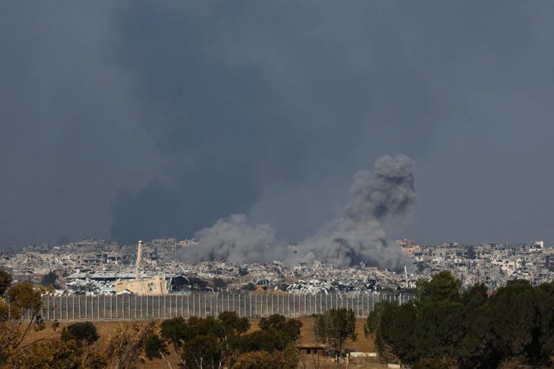 Smoke rises from an Israeli strike as the Israeli military conducts operations inside the Gaza Strip, amid the ongoing conflict between Israel and Hamas, as seen from southern Israel, January 1, 2025. REUTERS/Kai Pfaffenbach