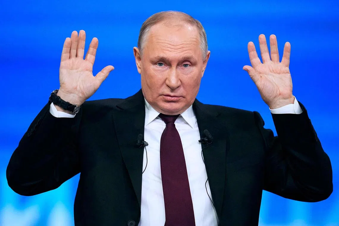 TOPSHOT - Russian President Vladimir Putin holds his year-end press conference at Gostiny Dvor exhibition hall in central Moscow on December 14, 2023. (Photo by Alexander Zemlianichenko / POOL / AFP)