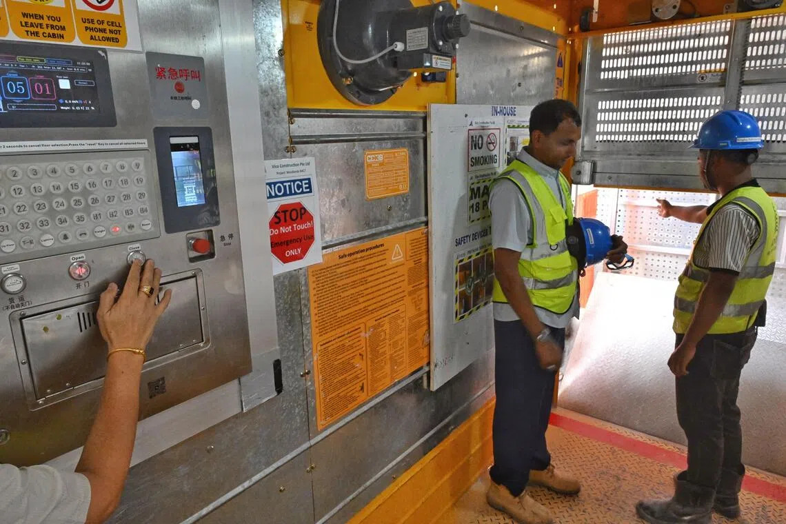 The door of the smart hoist will not close if it detects safety hazards, such as a worker without a helmet or a hand in the way of the door.