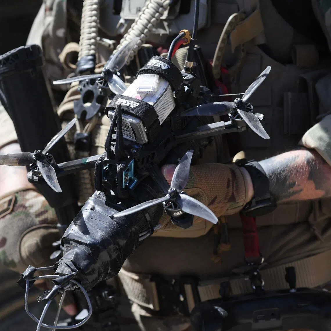 A soldier of the French Army Robotics Exploration Section holds an FPV drone during a dynamic demonstration of military equipment at the Eurosatory defence and security trade show at the Paris Nord Villepinte Exhibition Centre on June 14, 2026. 