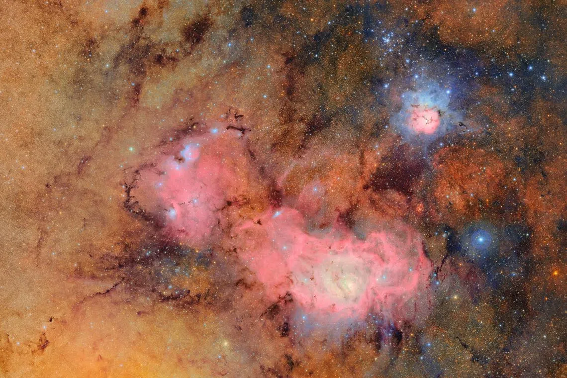 The Trifid and Lagoon Nebulae are seen in an image produced by the Vera C. Rubin Observatory, on Pachon Hill, Coquimbo Region, Chile June 12, 2025. RubinObs/NOIRLab/SLAC/NSF/DOE/AURA/Handout via REUTERS