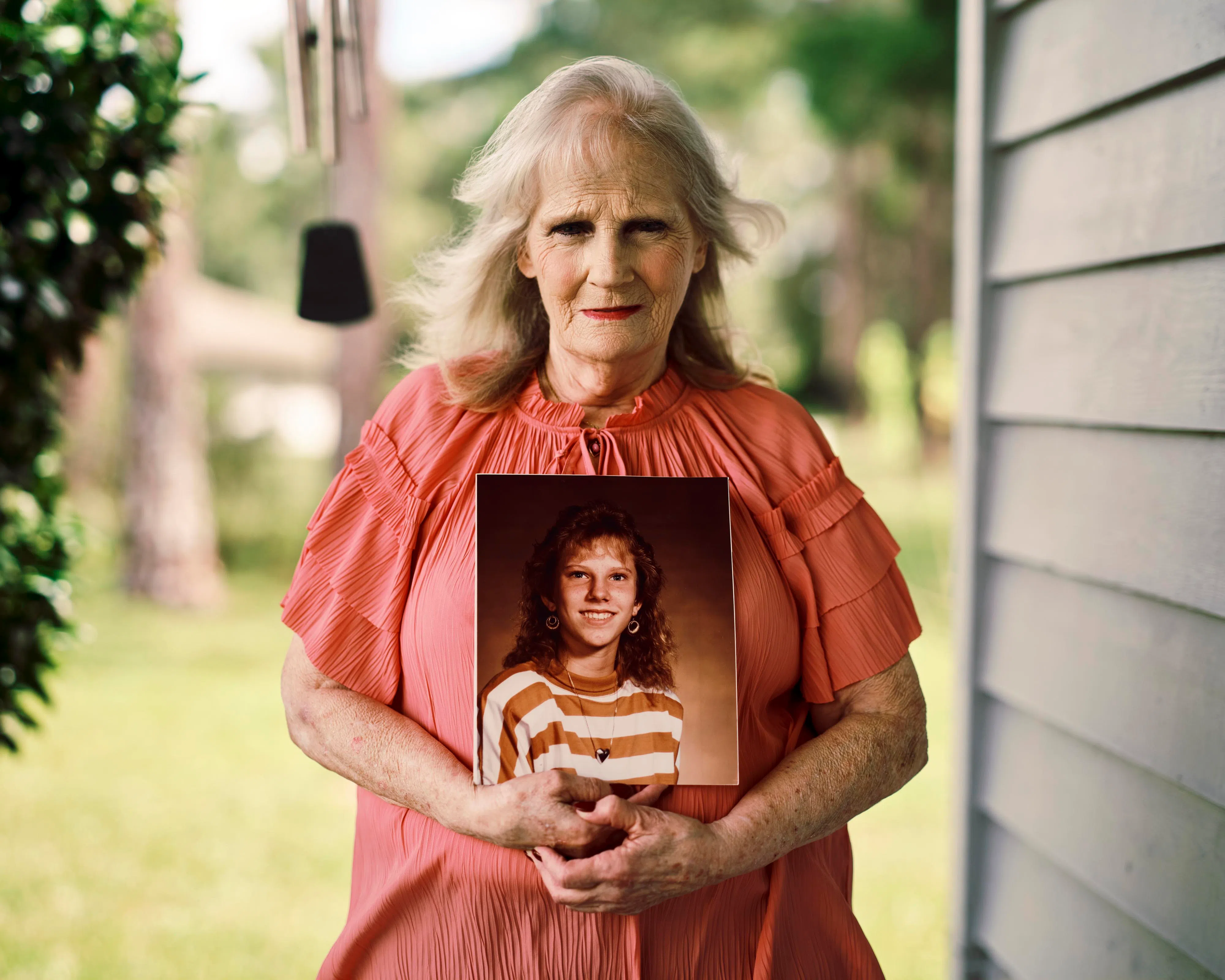 May Martinez holding a photo of her daughter, Colleen Slemmer, at her home in Palatka, Florida, in September 2026.