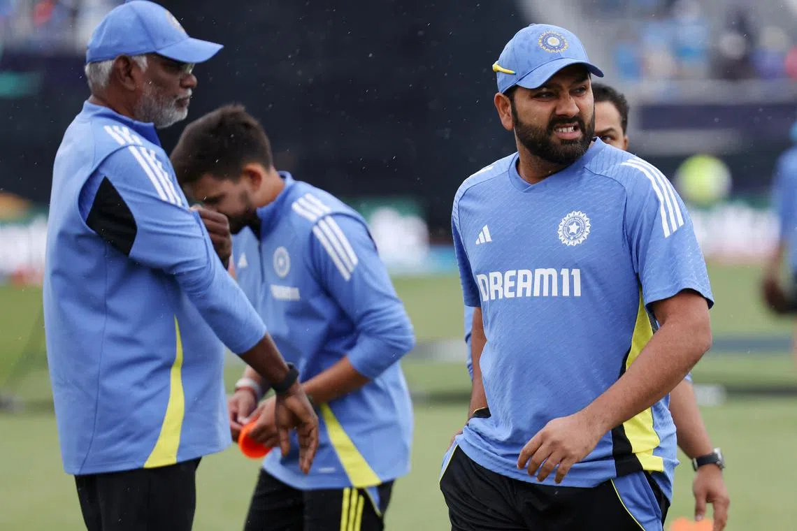Cricket - ICC T20 World Cup 2024 - Group A - India v Pakistan - Nassau County International Cricket Stadium, New York, United States - June 9, 2024 India's Rohit Sharma walks on the pitch in light rain during the warm up before the match REUTERS/Andrew Kelly