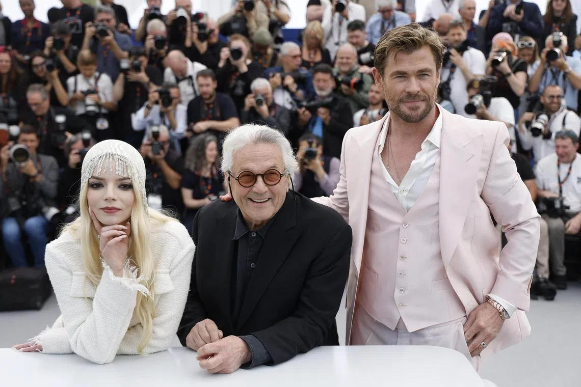 Actors Chris Hemsworth (R), Anya Taylor-Joy (L) and director George Miller attend the photocall for 'Furiosa: A Mad Max Saga during the 77th annual Cannes Film Festival, in Cannes, France, on May 16, 2024. The movie is presented out of competition of the festival which runs from 14 to 25 May 2024.  