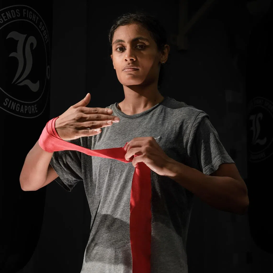 Before she puts on her boxing gloves, Danisha Mathialagan wraps her hands in metres of cloth. 