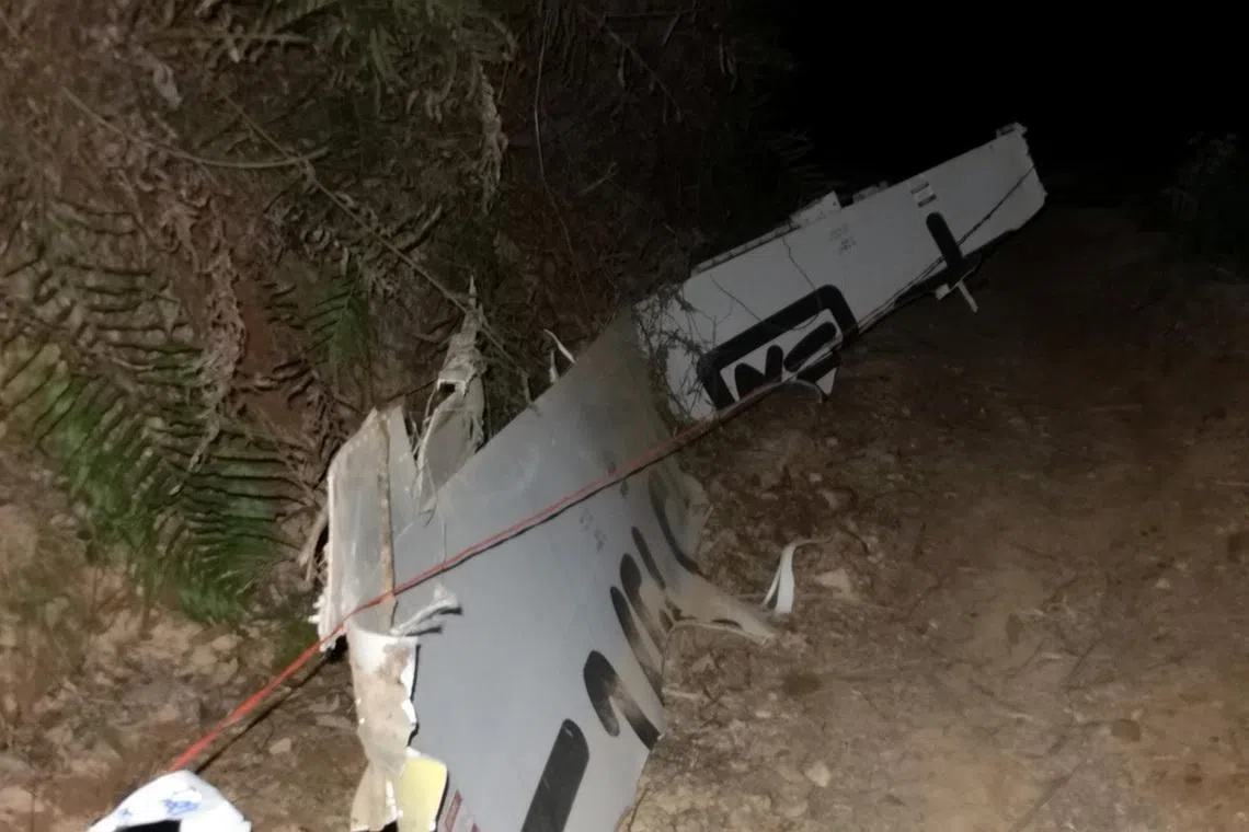 Plane debris is seen at the site where a China Eastern Airlines Boeing 737-800 plane flying from Kunming to Guangzhou crashed, in Wuzhou, Guangxi Zhuang Autonomous Region, China March 21, 2022. Picture taken March 21, 2022. cnsphoto via REUTERS